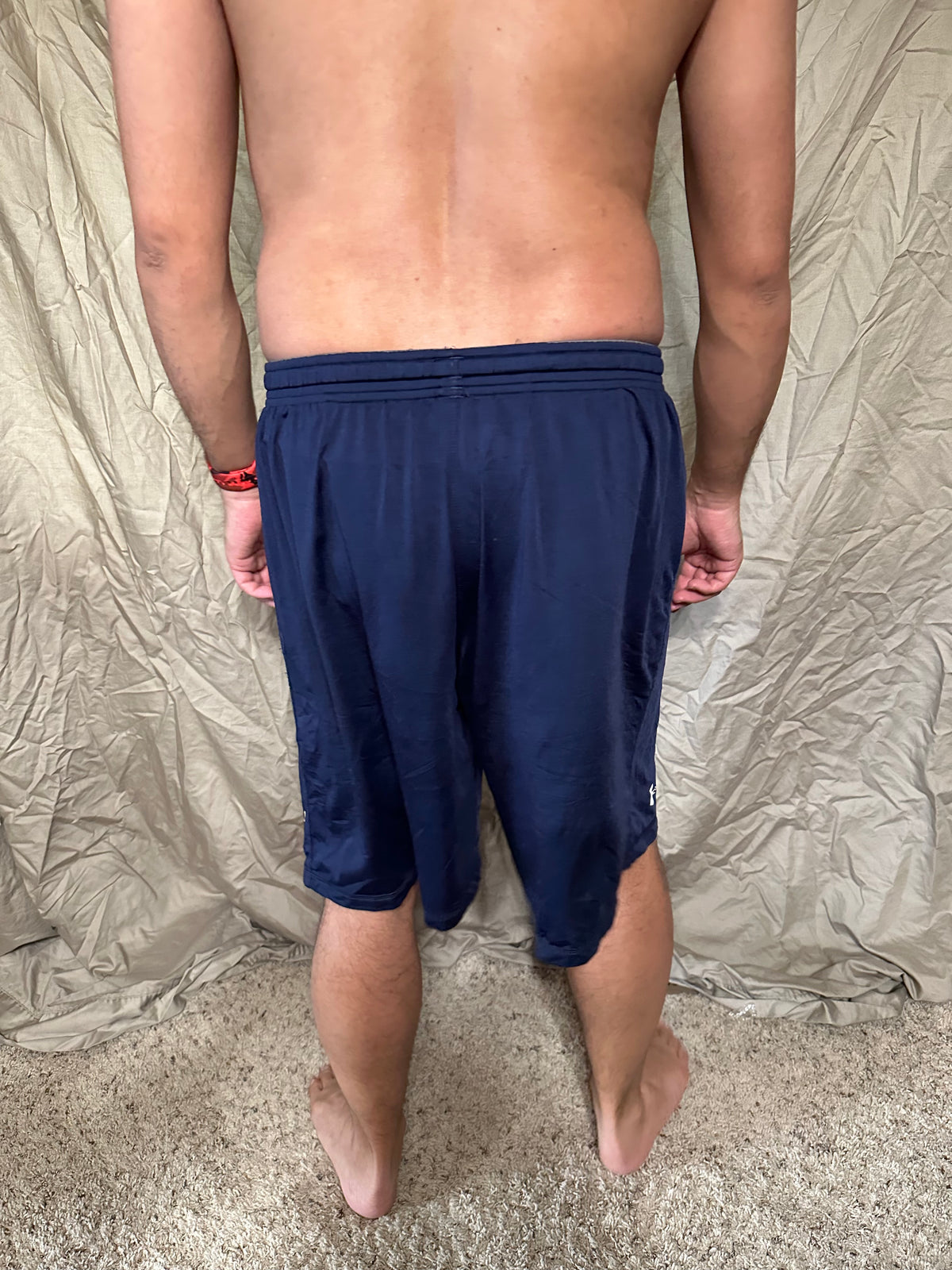 Men’s navy blue under armour heat gear loose shorts athletic no pockets rampart ridge high school track and field